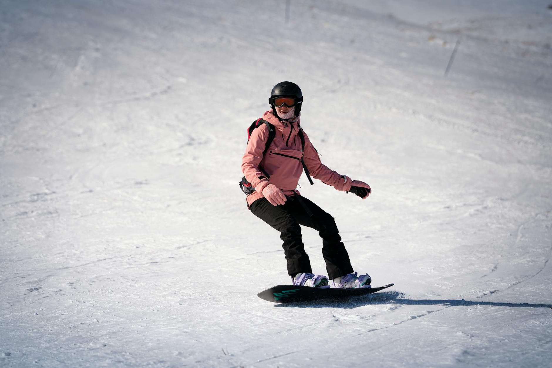 snowboarder in action on sunny winter day